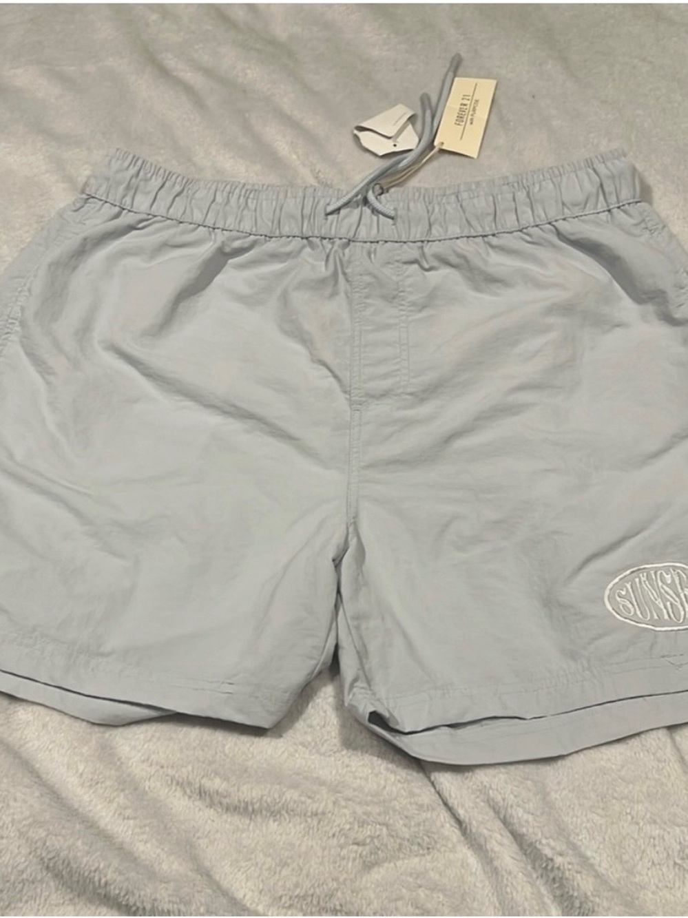 Light Blue Drawstring Swim Shorts with Embroidered Patch ( NEVER WORN)